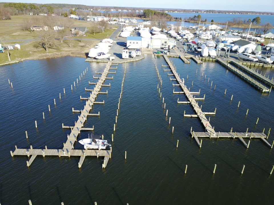 Aerial view of the marina docks with storage and service areas beyond